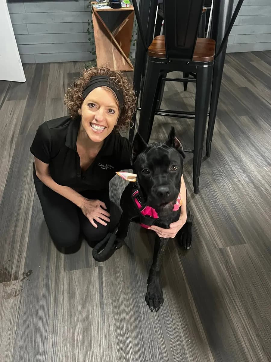 Keri with her dog inside the spa